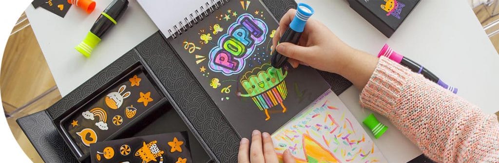 Arts and Crafts Category - Child coloring with markers on a Tiger Tribe Coloring Set