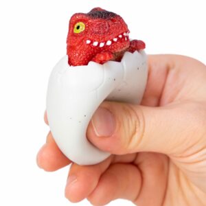 Squeezy Egg Popper toy in hand, squeezed and dino popping out